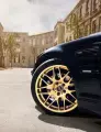 The Bold and the Beautiful: A Black Car with Gold Wheels